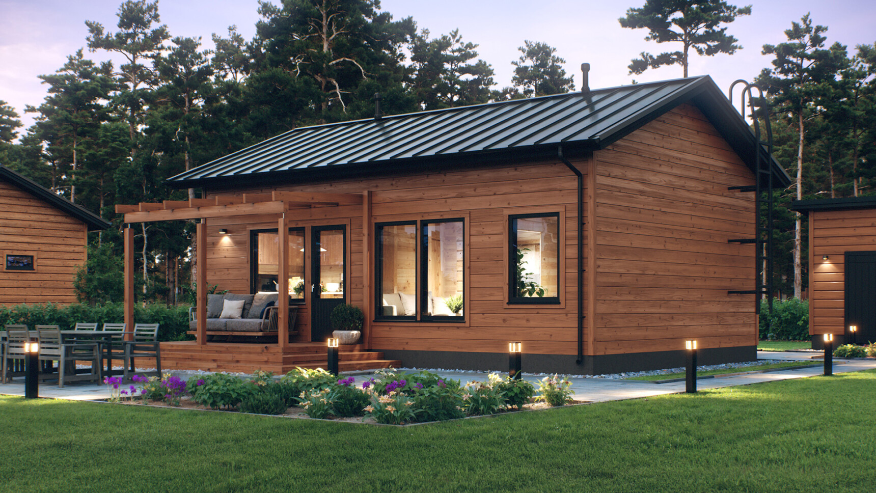 Harjakattoinen pieni hirsitalo. Takapihalla on pieni katos terassin päällä.