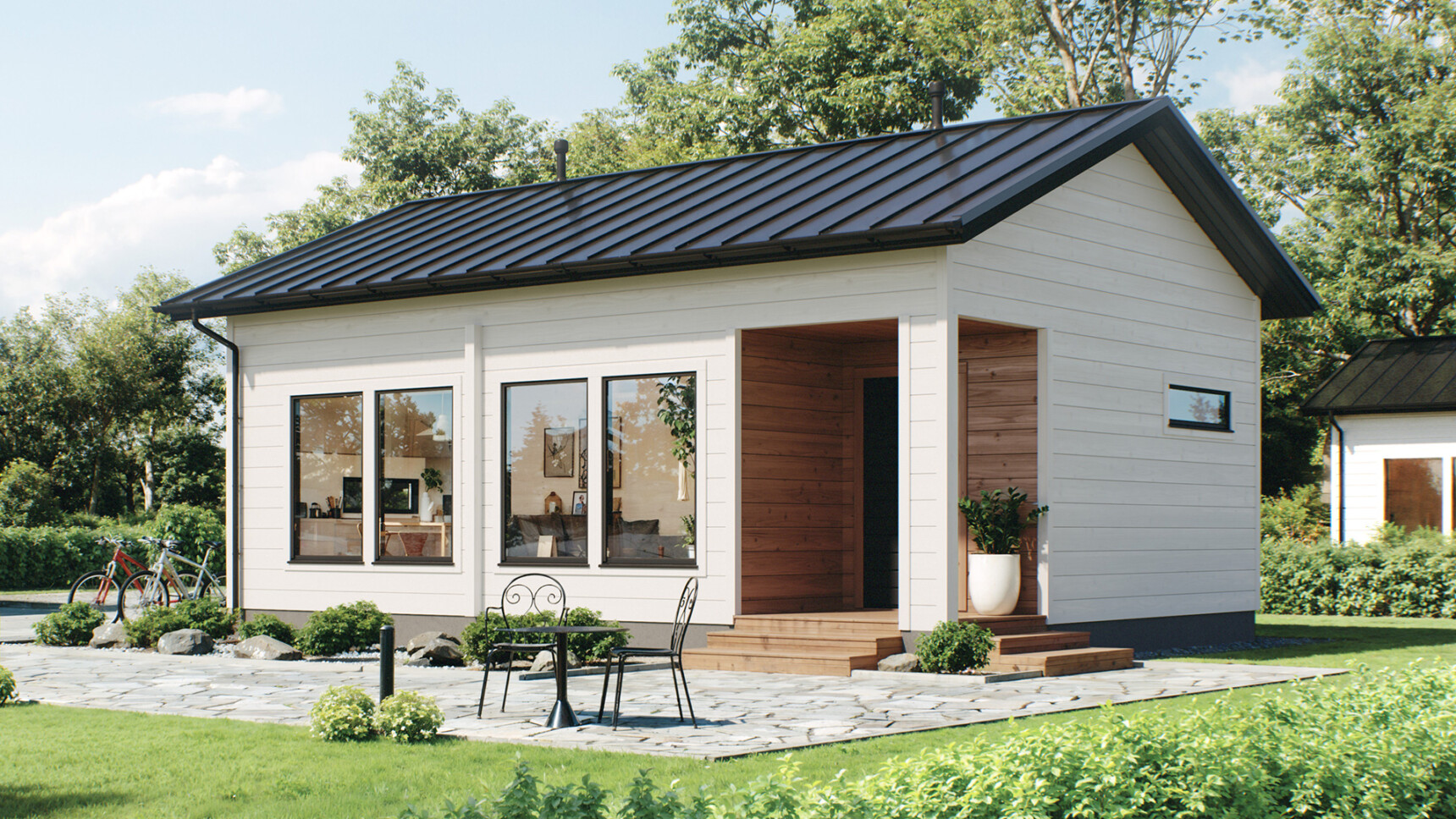 Harjakattoinen pieni hirsitalo, jossa on syvennetty sisäänkäynti.